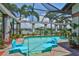 The swimming pool has an inground spa and the screened pool area has relaxing floating lounge chairs at 5417 Tybee Island Dr, Apollo Beach, FL 33572