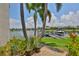 Waterfront view of boat dock, boat lift, and lush foliage at 5417 Tybee Island Dr, Apollo Beach, FL 33572