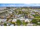 Aerial view showcasing the neighborhood's charming homes, nearby canal, and community pool at 600 71St Ave # 16, St Pete Beach, FL 33706