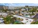Aerial view showing the property with a pool in a community near the beach at 600 71St Ave # 16, St Pete Beach, FL 33706