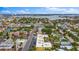 Scenic aerial view of the surrounding neighborhood, nearby lake, and tree-lined streets at 600 71St Ave # 16, St Pete Beach, FL 33706