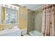 Cozy bathroom featuring a shower-tub combination and nautical decorations, offering a relaxed space at 600 71St Ave # 16, St Pete Beach, FL 33706