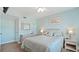 Charming bedroom features a beachy aesthetic with white wicker furniture and a ceiling fan at 600 71St Ave # 16, St Pete Beach, FL 33706