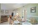 Cozy dining area with a glass table and seating area, offering a relaxed atmosphere at 600 71St Ave # 16, St Pete Beach, FL 33706