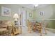 Inviting dining area featuring a glass-topped table and wicker chairs, perfect for meals at 600 71St Ave # 16, St Pete Beach, FL 33706
