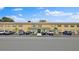 Image showcasing the building's facade, parking spots, and well-kept landscaping at 600 71St Ave # 16, St Pete Beach, FL 33706