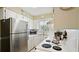 Functional kitchen featuring stainless steel refrigerator and black oven range at 600 71St Ave # 16, St Pete Beach, FL 33706
