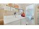 Laundry room near beach-themed bedroom has washer, dryer, and storage at 600 71St Ave # 16, St Pete Beach, FL 33706