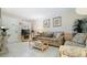 Cozy living room features comfortable seating, tile floors, and a view of the TV at 600 71St Ave # 16, St Pete Beach, FL 33706