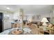 Inviting living room and kitchen area with comfortable seating and bright, airy space at 600 71St Ave # 16, St Pete Beach, FL 33706