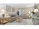 Cozy living room features comfortable seating, tile floors, and bright, airy decor at 600 71St Ave # 16, St Pete Beach, FL 33706