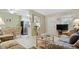 Inviting living room with tile floors, comfortable seating, and a view into the dining area at 600 71St Ave # 16, St Pete Beach, FL 33706