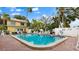 Enjoy the inviting pool surrounded by lush landscaping and lounge chairs for relaxation at 600 71St Ave # 16, St Pete Beach, FL 33706
