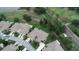 Beautiful aerial view of a golf course community with well-maintained lawns and landscaping at 611 Tremont Greens Ln, Sun City Center, FL 33573