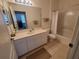 Bathroom features tile floors, shower-tub, and vanity sink at 611 Tremont Greens Ln, Sun City Center, FL 33573