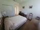 Neutral bedroom features carpet, ceiling fan, closet, and bed at 611 Tremont Greens Ln, Sun City Center, FL 33573