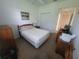 Comfortable bedroom with carpet, ceiling fan, closet, and bed at 611 Tremont Greens Ln, Sun City Center, FL 33573