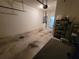 Uncluttered garage with storage shelves, utility closet and concrete flooring at 611 Tremont Greens Ln, Sun City Center, FL 33573