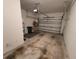 Spacious garage with concrete floor and ample storage at 611 Tremont Greens Ln, Sun City Center, FL 33573