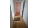 Neutral hallway features wood floors with doors to other rooms at 611 Tremont Greens Ln, Sun City Center, FL 33573