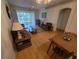 Bright living room featuring hardwood floors and a comfortable seating arrangement at 611 Tremont Greens Ln, Sun City Center, FL 33573
