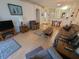 Inviting living room showcasing open layout, neutral paint, and hardwood floors at 611 Tremont Greens Ln, Sun City Center, FL 33573