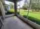 Relaxing screened-in patio offering serene views of the golf course at 611 Tremont Greens Ln, Sun City Center, FL 33573