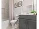 Stylish bathroom with gray vanity, tub-shower combo and modern fixtures, creating a relaxing space at 6123 Golden Nettle Dr, Apollo Beach, FL 33572