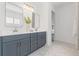 Bathroom boasts dual sinks, framed mirrors, and modern fixtures at 6123 Golden Nettle Dr, Apollo Beach, FL 33572