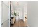 Bright entryway with modern decor and hardwood floors leading to the living areas and bedrooms at 6123 Golden Nettle Dr, Apollo Beach, FL 33572