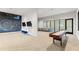 Bright game room with shuffleboard, lounge, and chalkboard wall with festive congratulations message and the Waterset Club at 6123 Golden Nettle Dr, Apollo Beach, FL 33572