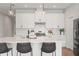 Bright kitchen with white cabinets, an island, and stainless steel appliances at 6123 Golden Nettle Dr, Apollo Beach, FL 33572