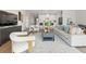 Cozy living room featuring a comfortable sofa and stylish armchairs at 6123 Golden Nettle Dr, Apollo Beach, FL 33572