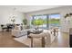 Bright living room with modern furnishings and a view of the pool at 6123 Golden Nettle Dr, Apollo Beach, FL 33572