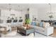 Open-concept living space with sleek furniture and modern finishes at 6123 Golden Nettle Dr, Apollo Beach, FL 33572