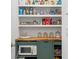 Well-stocked pantry with shelving and a microwave at 6123 Golden Nettle Dr, Apollo Beach, FL 33572
