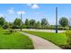 Bright and sunny community volleyball court with a picnic table to the side for rest and refreshments at 6123 Golden Nettle Dr, Apollo Beach, FL 33572