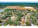 Neighborhood aerial showcases tree lined streets and the proximity to a large open field at 613 Sportsman Park Dr, Seffner, FL 33584