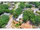 Aerial view showcasing the home's location amidst lush greenery and surrounding neighborhood at 613 Sportsman Park Dr, Seffner, FL 33584