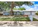 Lovely single Gathering home with a large front yard and mature landscaping at 613 Sportsman Park Dr, Seffner, FL 33584