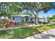 Charming single Gathering home with gorgeous curb appeal and mature landscaping at 613 Sportsman Park Dr, Seffner, FL 33584