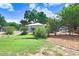 Charming front yard adorned with colorful flowering bushes, neat landscaping, and verdant green grass at 613 Sportsman Park Dr, Seffner, FL 33584