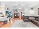 Spacious living room with hardwood floors, large windows, and open concept layout at 613 Sportsman Park Dr, Seffner, FL 33584