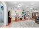 Open-concept living space with hardwood floors, kitchen view, and ample natural light at 613 Sportsman Park Dr, Seffner, FL 33584