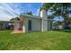 The backyard has manicured lawn, mature trees, and a privacy fence at 6282 41St N Ave, St Petersburg, FL 33709