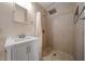 Bathroom featuring tiled shower and modern vanity at 6282 41St N Ave, St Petersburg, FL 33709