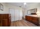 Bedroom with hardwood flooring, ceiling fan and large mirror at 6282 41St N Ave, St Petersburg, FL 33709