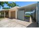Property featuring a garage and covered carport with gate access at 6282 41St N Ave, St Petersburg, FL 33709