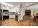 Bright kitchen with stainless steel appliances, granite counters, open to the dining and living area at 6282 41St N Ave, St Petersburg, FL 33709