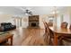 Open-concept living room boasts stone fireplace and hardwood flooring at 6282 41St N Ave, St Petersburg, FL 33709